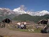 102 Crew At Choya With Dhaulagiri Jerome Ryan, Gyan Tamang We walked through a pine forest, and then to Choya (2630m), the last village we would see, with a magnificent sweeping view of Dhaulagiri to Tukuche Peak (6920m). Here is my crew in Choya with Dhaulagiri behind: cook Ang Phuri Sherpa; porters Dhansing, Dhan Bahadur Tamang, and Ram Bahadar Tamang; and guide Gyan Tamang. I noticed that the local people were drinking heavily, just like in 1950. �The sounds of laughter, singing and general hilarity led me to suspect that chang - rice-alcohol - was being generously distributed� (Maurice Herzog, Annapurna).